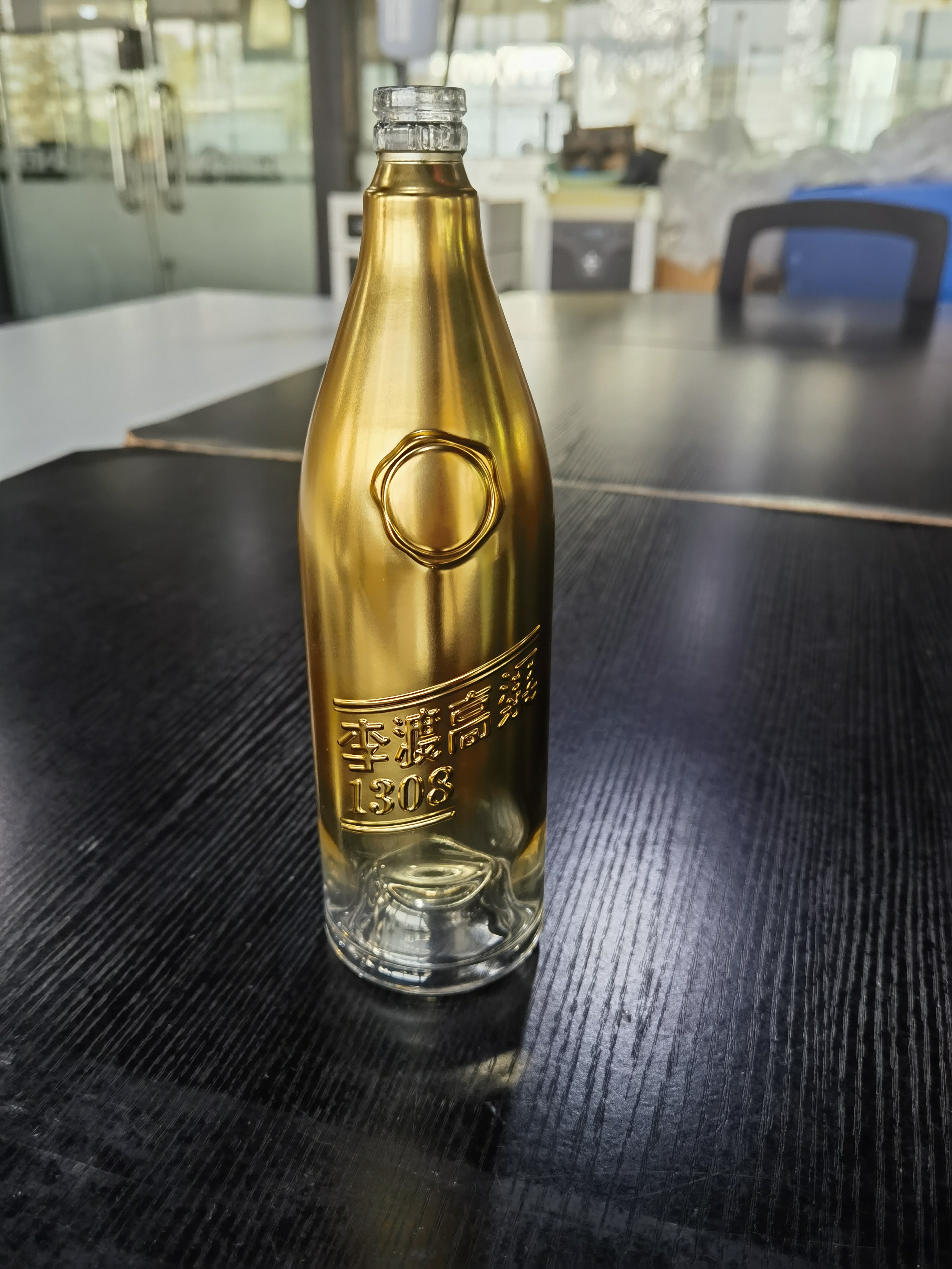 electroplating finish on vodka glass bottle